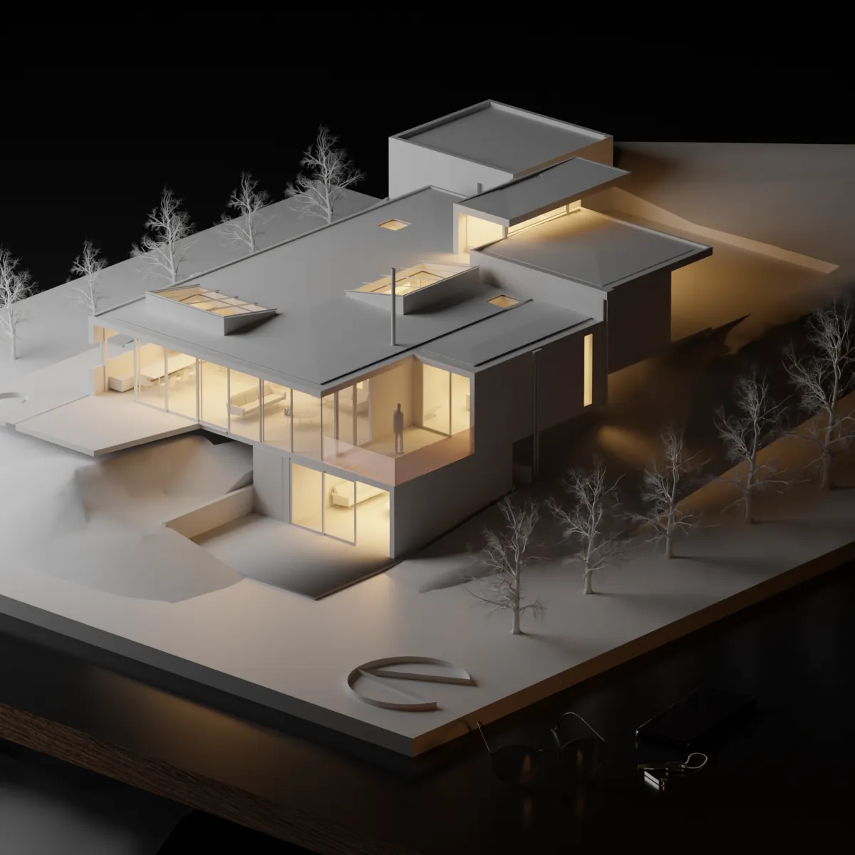 Night rendering of the house shown as a lit architectural model on a dark plinth, with bare trees across the site and warm light spilling from the interiors.